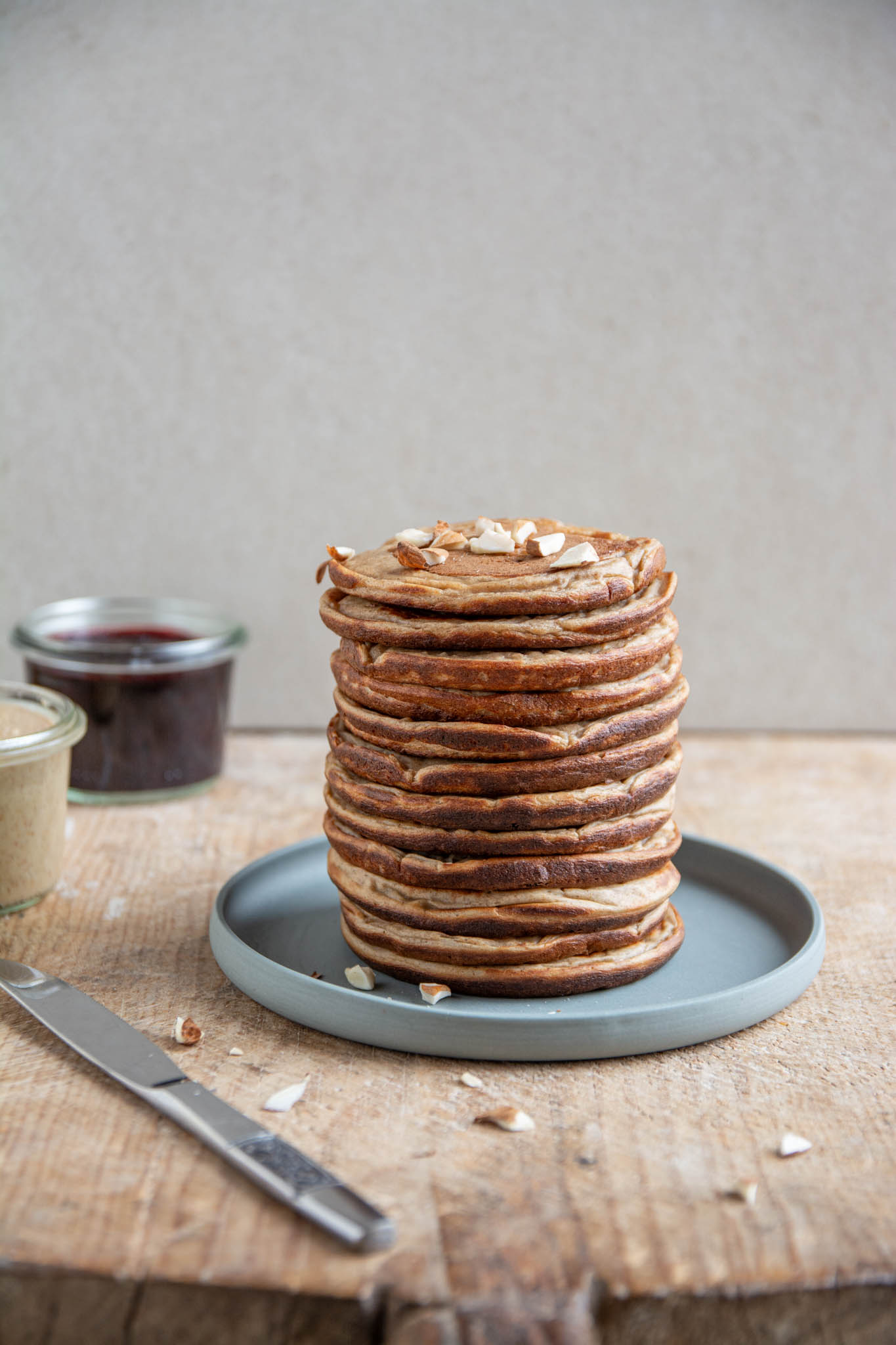 A stack of high-protein pancakes made of buckwheat, spelt, cooked soybeans, dates, oat milk.