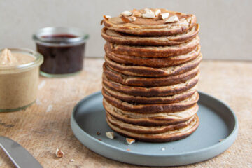 A stack of high-protein pancakes made of buckwheat, spelt, cooked soybeans, dates, oat milk.