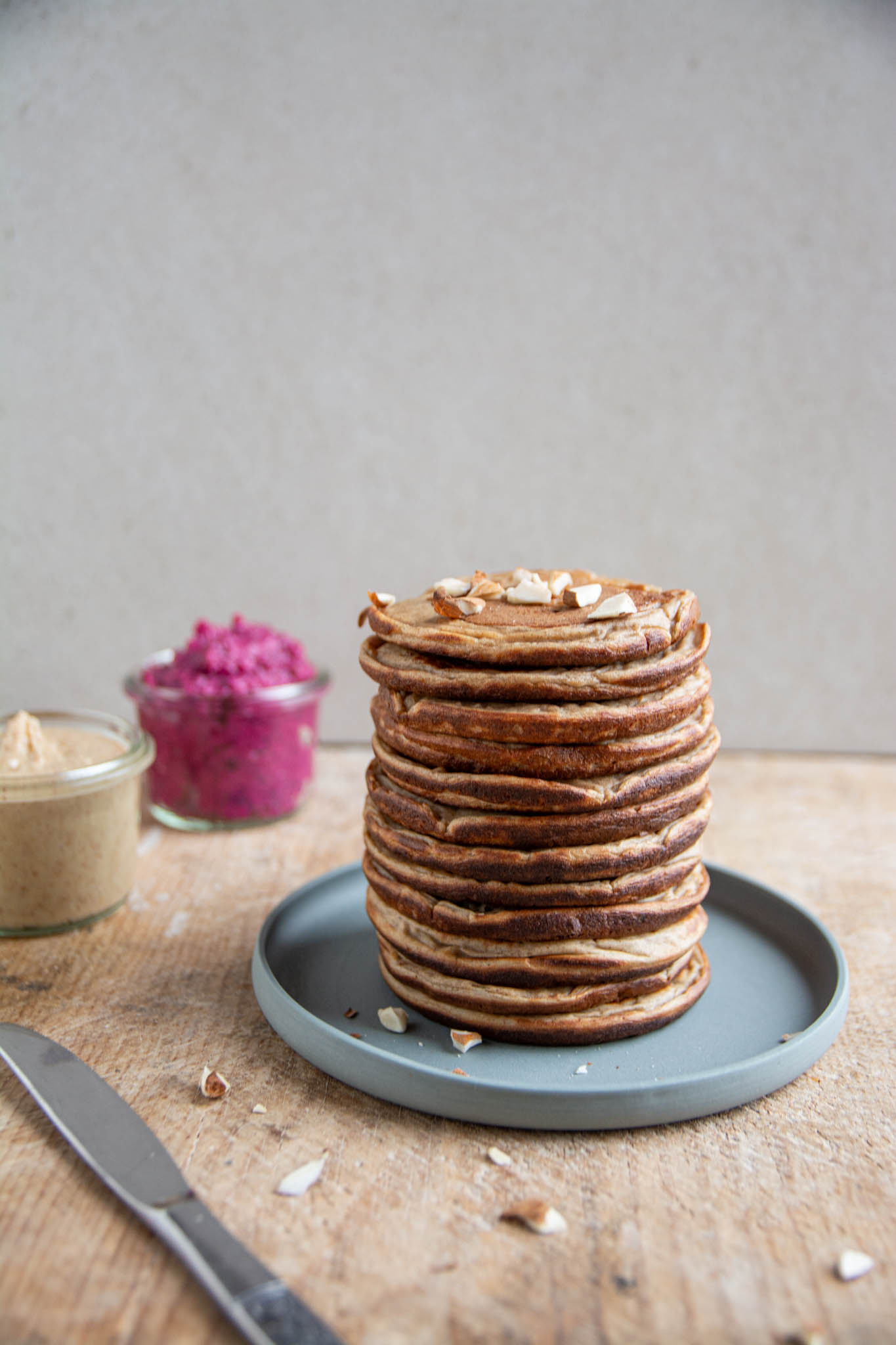 A stack of high-protein pancakes made of buckwheat, spelt, cooked soybeans, dates, oat milk.